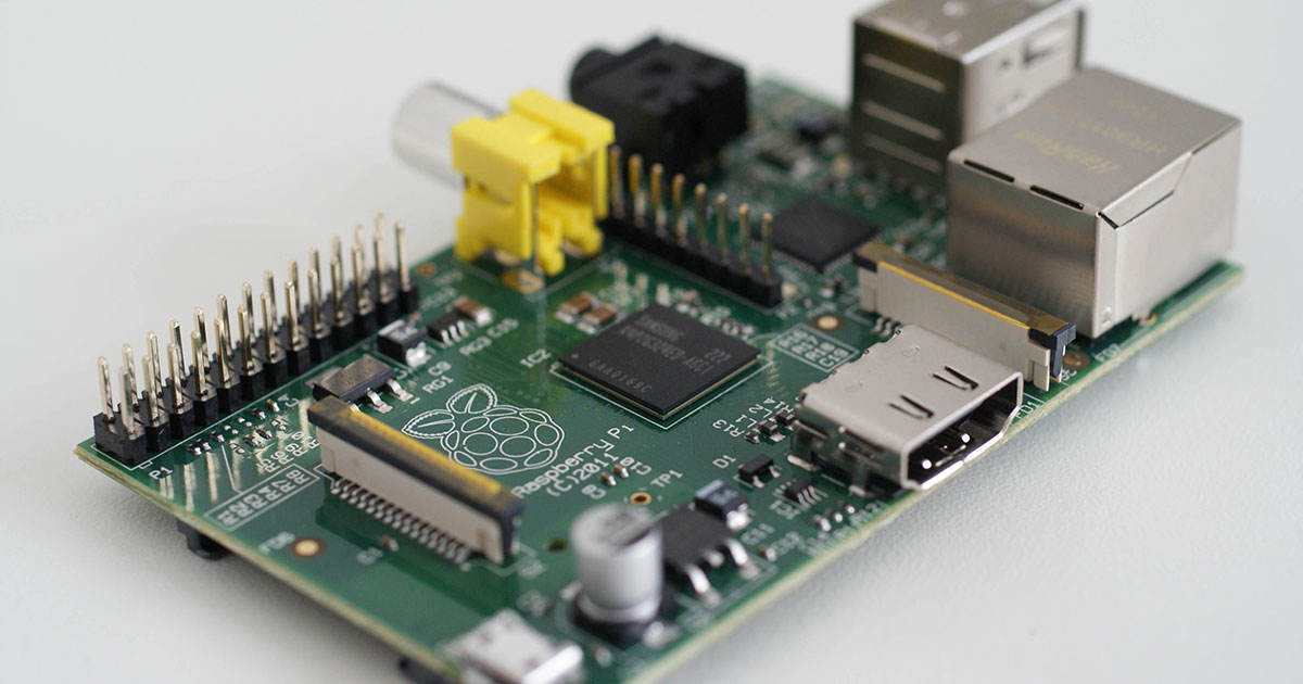 A Raspberry Pi board on a desk with SD card and USB peripherals