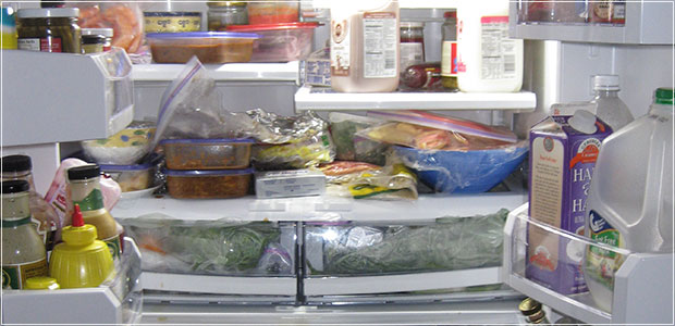 A bowl of pasta with a rich pepper and chicken sauce