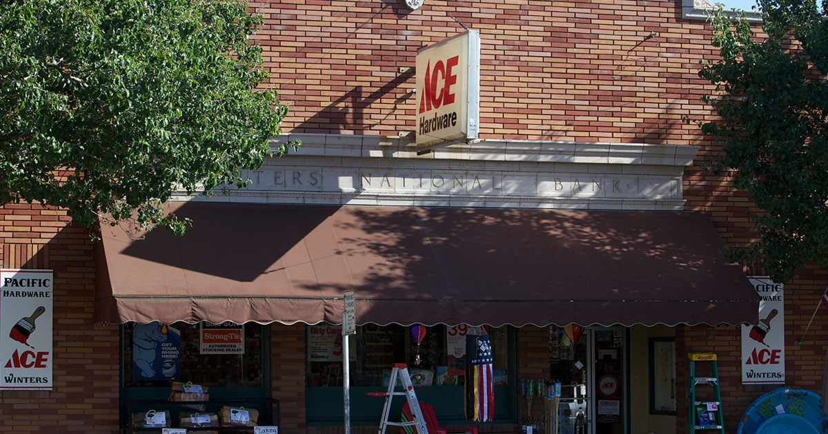 Rows of hardware store drawers filled with nuts, bolts, and fasteners